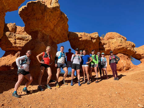 A group in Zion posing during a guided trail running experience
